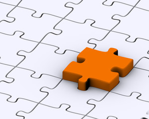 Last orange piece to complete jigsaw puzzle