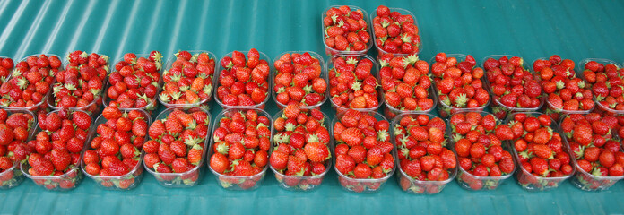 Display of fresh red strawberries in market in France