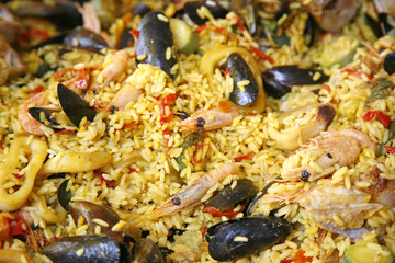 Fresh seafood paella on sale in market in France