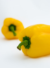 TWO YELOW PEPPERS