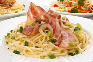 Pasta with fried bacon and vegetables