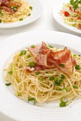 Pasta with fried bacon and vegetables