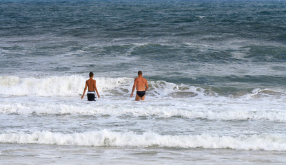 father and son  in the ocean