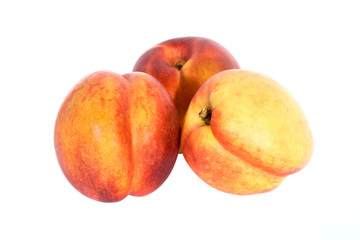 Three fresh nectarines isolated on white