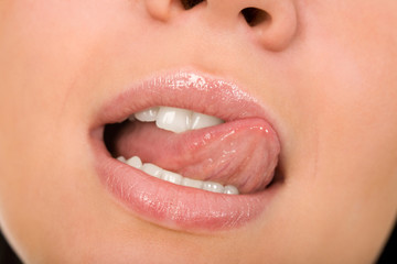 the female lips with cosmetics macro shot