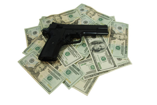 Money and black hand gun used for target practice
