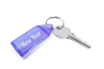 Key with New Year Key Ring on White Background