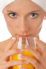Portrait of woman drinking juice after relaxing bath