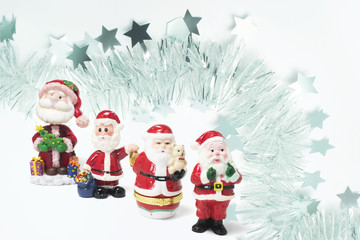 Santa Figures with Tinsel Background