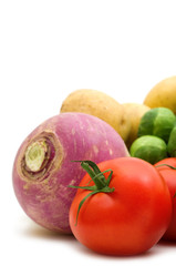 red tomato and vegetables on white background