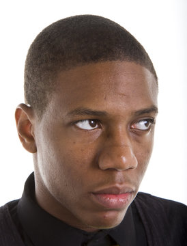 A nice looking young black man close up and looking left