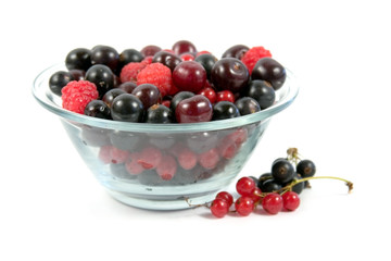 Plateful of berries on a white background
