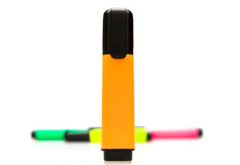 Some colorful marker on  white background. Front focus.