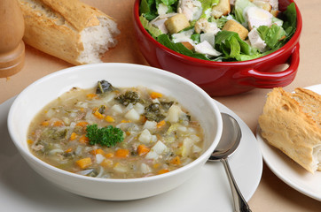 Lamb and vegetable soup with salad and bread