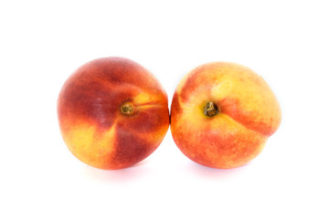 Two fresh nectarines isolated on white