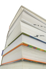Bottom view of stacked books isolated against white background..