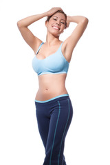 Fototapeta premium Young woman holding her hair wearing fitness clothes, great body