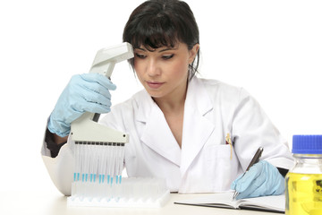 A female scientist documents laboratory test results