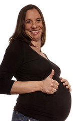 schwangere Frau großer Bauch halten Daumen hoch