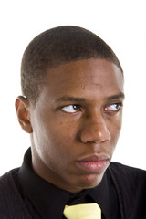 A nice young black man in a blackshirt and yellow tie