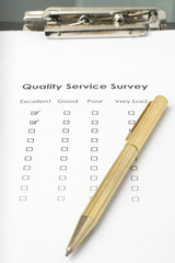 businessman filling out a questionnaire quality of service