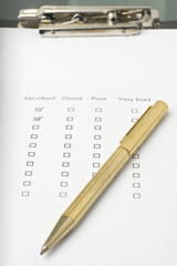 businessman filling out a questionnaire quality of service