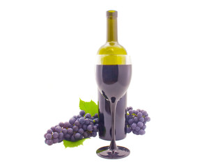 Bottle, glass and a cluster of grapes