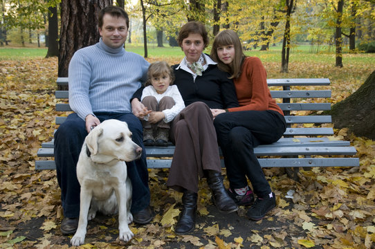 Happy family at autumn time
