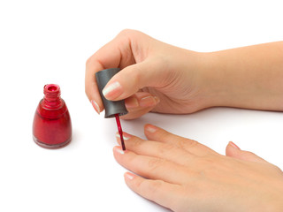 Woman hands - nail polish isolated on white background