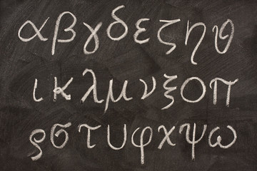 twenty four letters of Greek alphabet on a blackboard