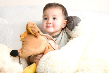 little hapy boy with his toys