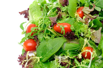 Background of salad leaves and cherry tomatoes with copyspace