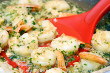 Shrimp scampi on spatula with selective focus