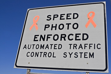 Speed photo enforced - sign on the expressway