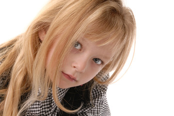 cute little blond girl close up with curious expression