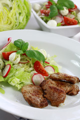 Pork steak with vegetable salad