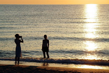 Fototapeta premium photographe et modele a la plage