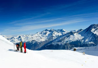 Tuinposter Skiers on the top of the mountain in Meribel Valley © Dmitry Naumov