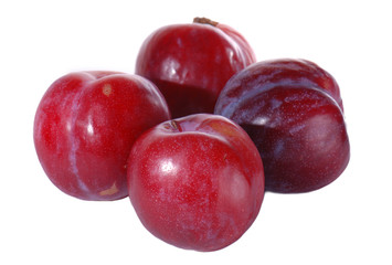 Red plums isolated on white background