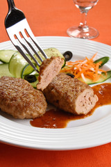 Fried steaks with vegetable salad