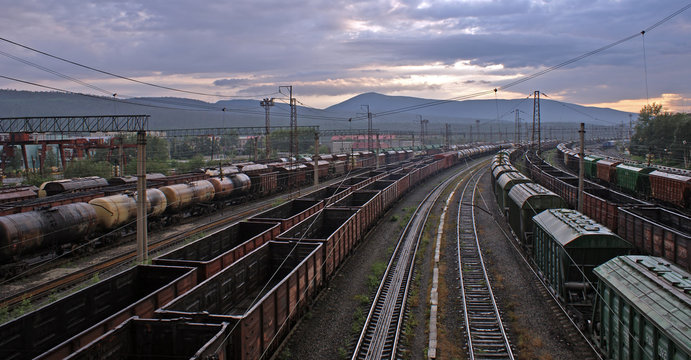 photo of railway station with different trains