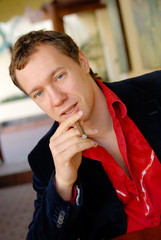 portrait of young man smoking a cigarette