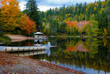 Fall colors in Canada's Algonquin Park reflected on a lake