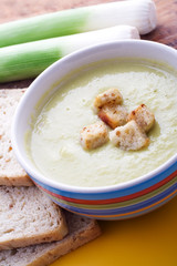 Bbowl full of leek soup with toasts addition