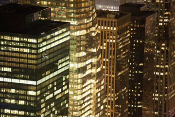 closer view of skyscrapers by night