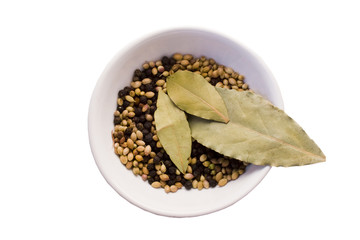 bay leaves,coriander seeds and black peppercorns in  bowl