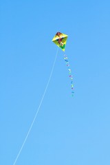 Colored kite sails on a clear blue sky