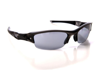 A pair of sports sunglasses or shades on a white background