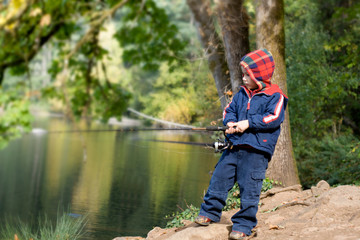 Cute 4 years old fisher boy