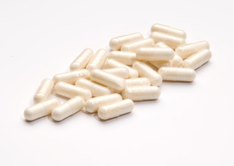 Fototapeta na wymiar A large group of randomly arranged pharmaceutical capsules